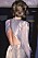 Diana i silverfärgad klänning med öppen rygg.