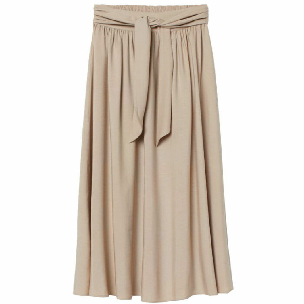 Klockad kjol i beige färg