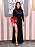 Sepideh Moafe anländer till Golden Globe i svart klänning med trendig blomapplikation.