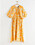gul blommig klänning med ballongärm från Lindex