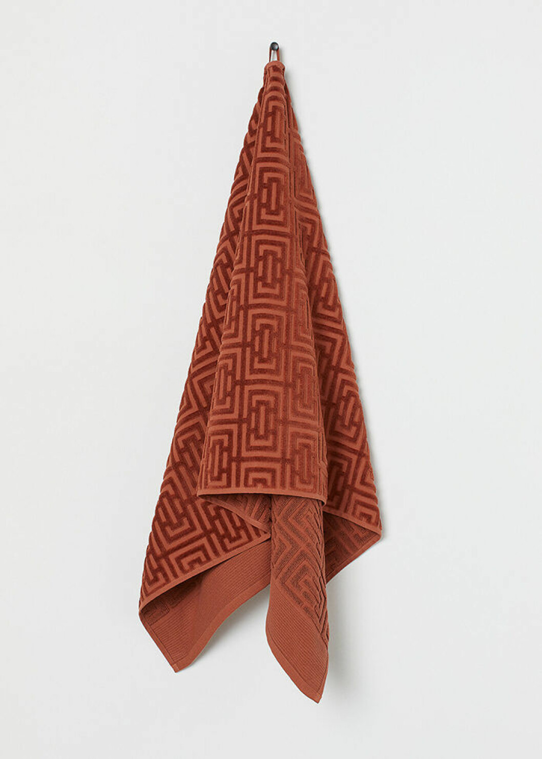Jacquardmönstrad handduk i orange från H&M Home