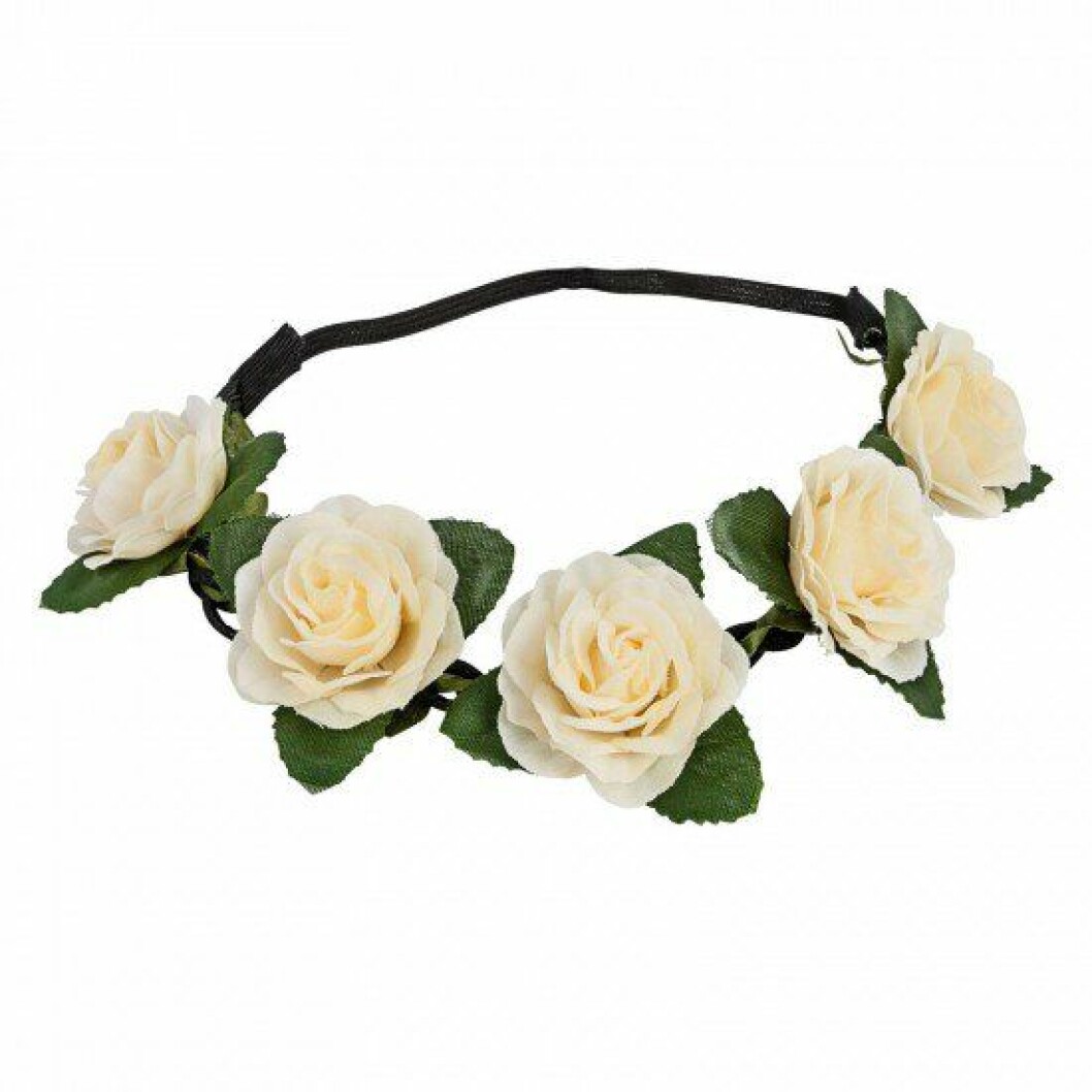 Hårband med vita blommor.