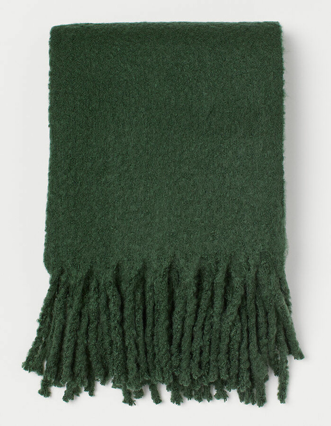 Mjuk pläd i djupgrönt från H&M Home hösten 2019