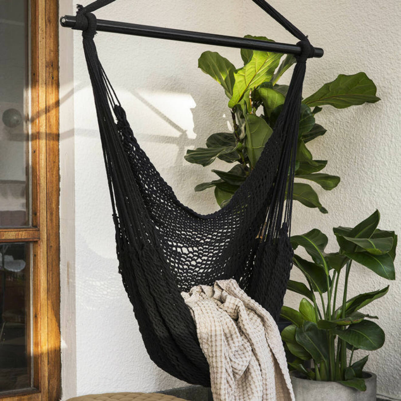 Cosy hanging chair at the balcony.