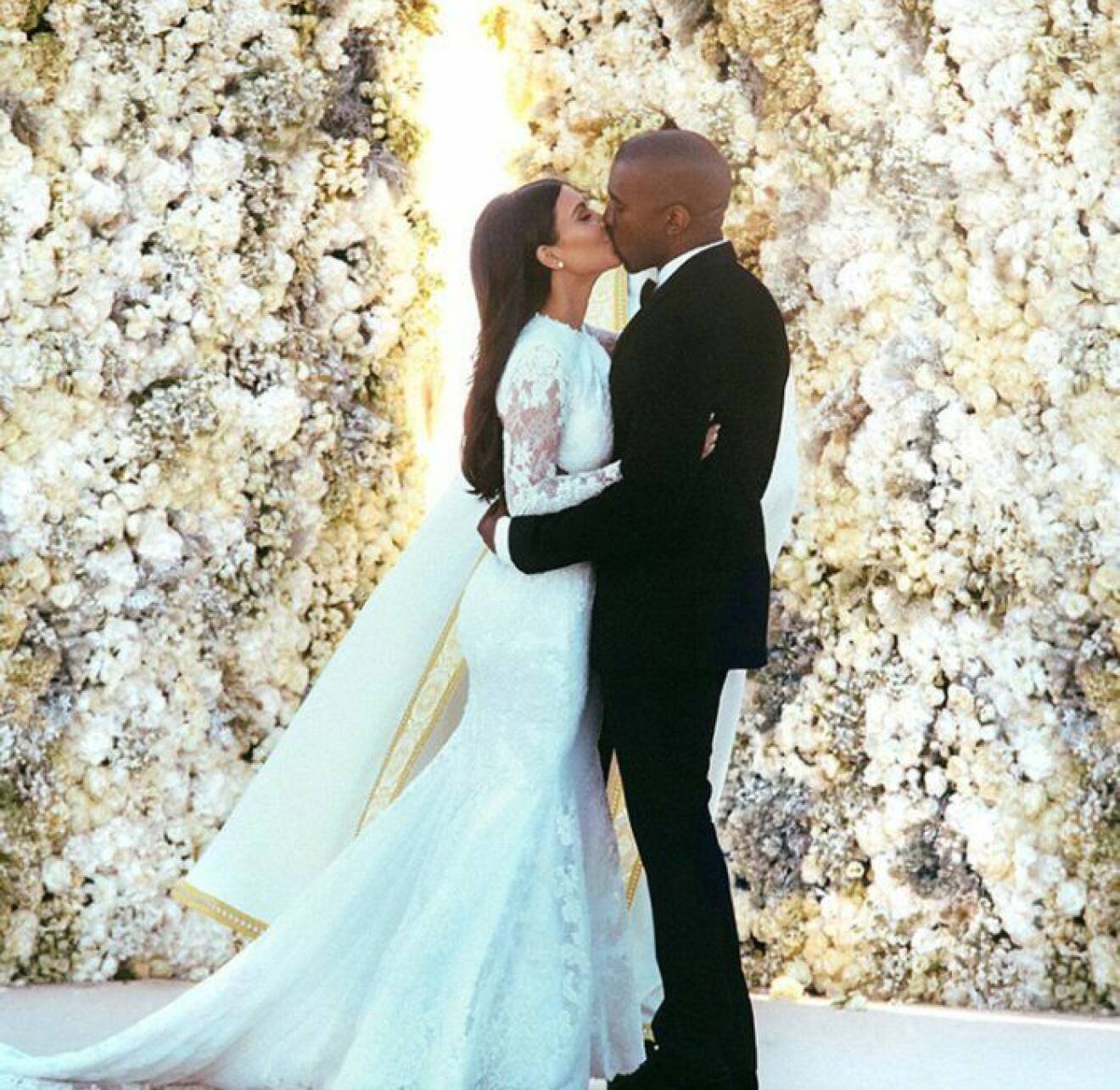 Kim Kardashian and Kanye West are seen kissing on their wedding day just moments after saying 'I do' at Forte di Belvedere in Florence, Italy -2014 REF NO : 74018 FOR EDITORIAL USE ONLY Scope Features Agency does not claim any Copyright or License in the attached material. Any downloading fees charged by Scope are for Scope services only, and do not, nor are they intended to, convey to the user any Copyright or License in the material. By publishing this material , the user expressly agrees to indemnify and to hold Scope harmless from any claims, demands, or causes of action arising out of or connected in any way with user's publication of the material.