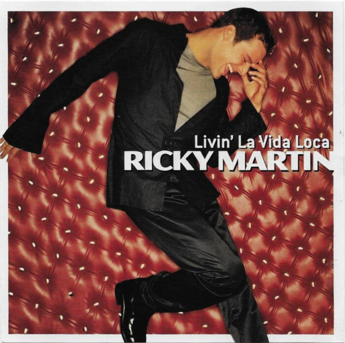 Omslaget till singeln Livin la vida loca av Ricky Martin.