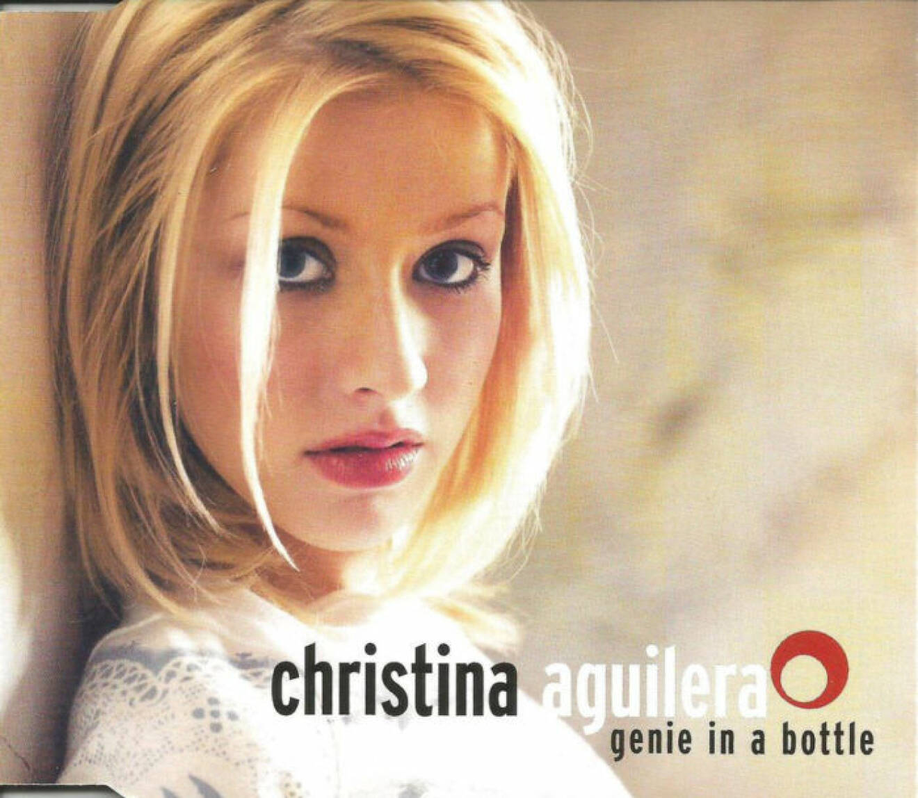 Omslag till singeln Genie in a bottle av Christina Aguilera.