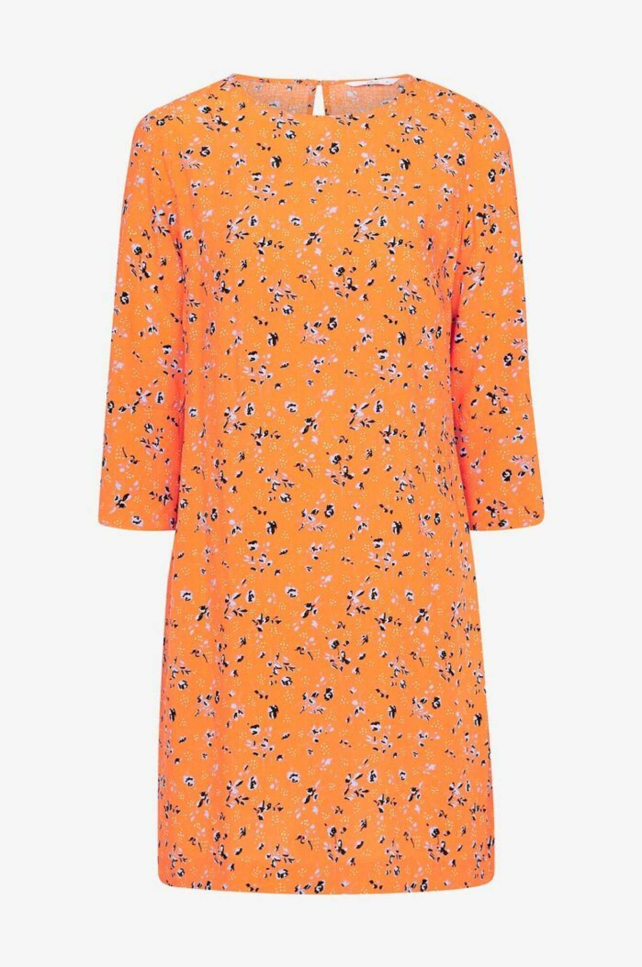 Orange blommig klänning
