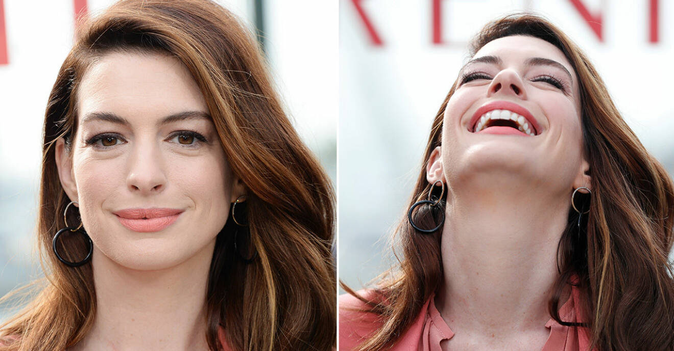 Anne Hathaway skrattar.