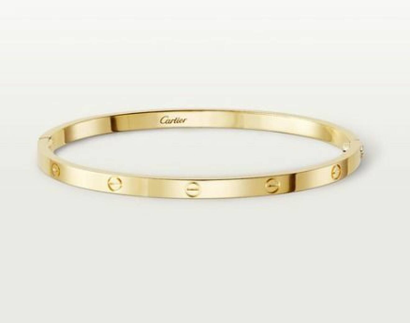 Stelt armband i guld från Cartier.