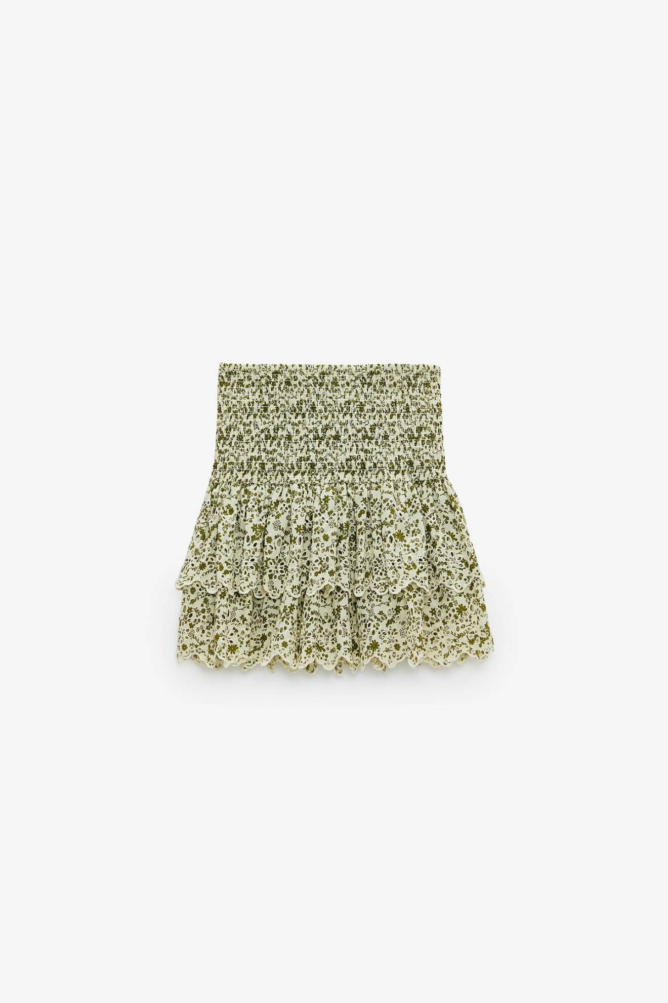 Blommig kjol i kort modell i gröna nyanser. Bred resår över magen och två lager med volangkant. Kjol från Zara.