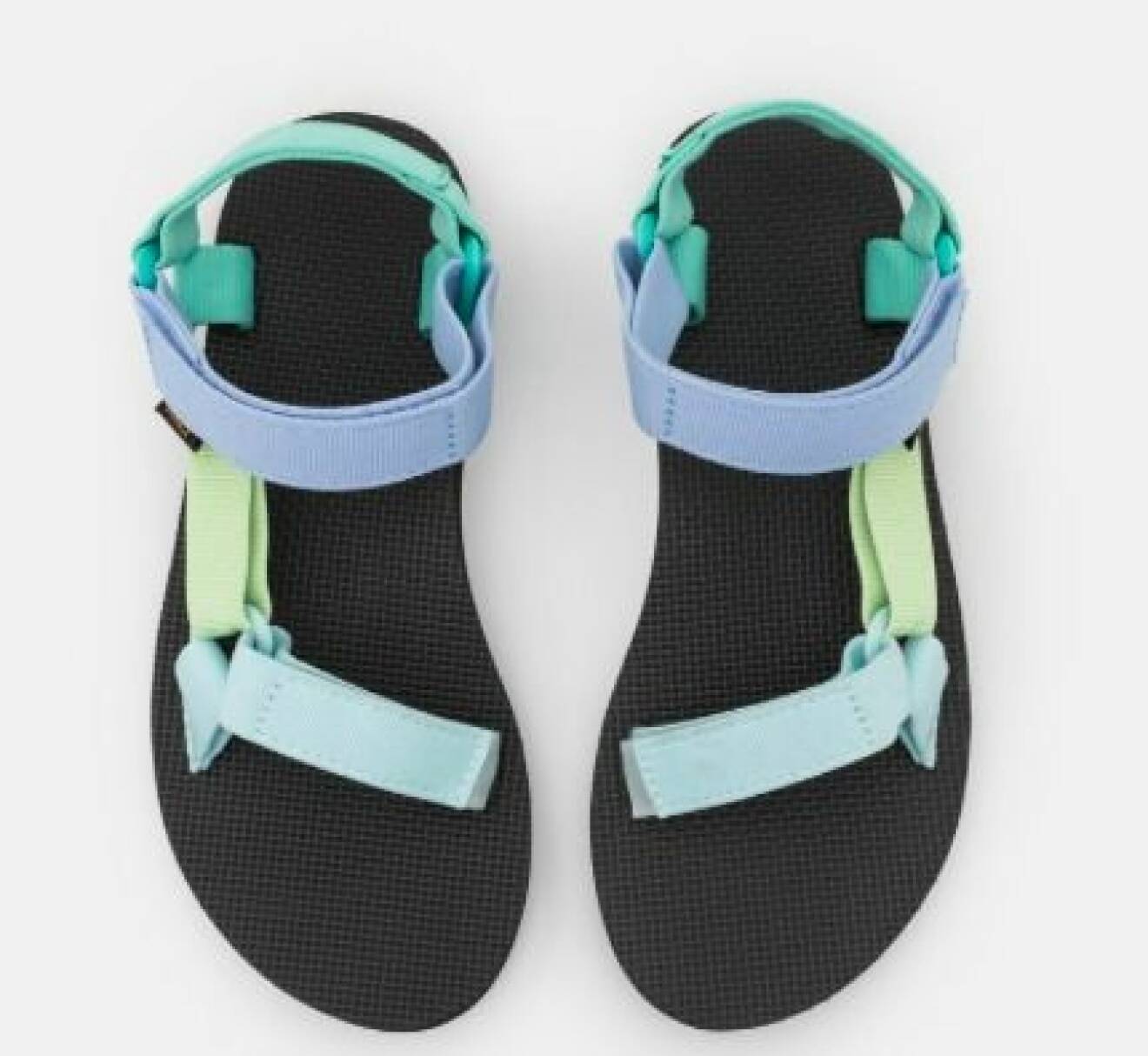 Sportiga sandaler med karborreband. Band i olika gröna och blå nyanser. Sandaler från Teva.