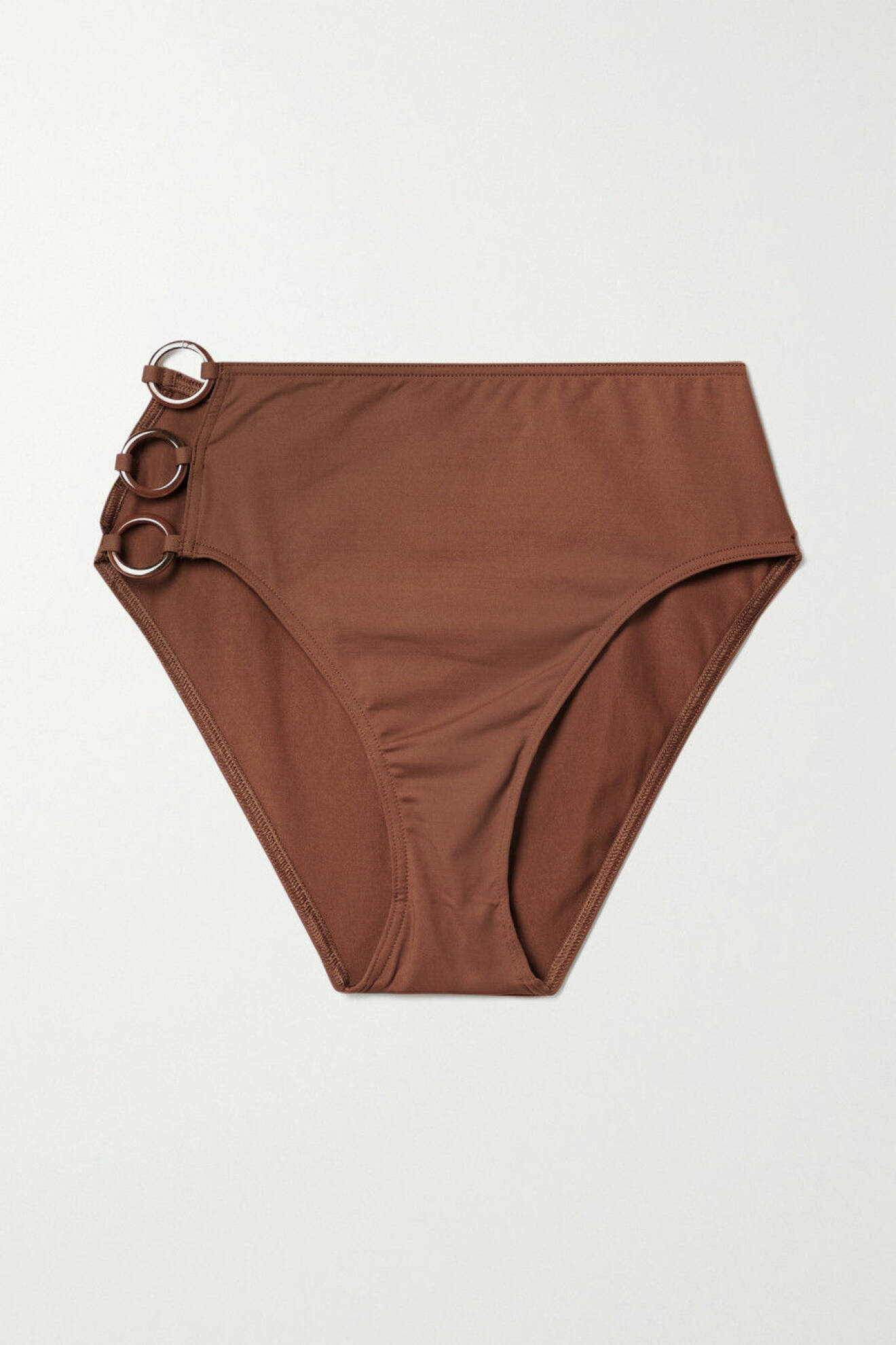 Bruna bikinitrosor med hög midja och cut out i ena sidan med tre bruna ringar som detalj. Bikinitrosor från Eres.
