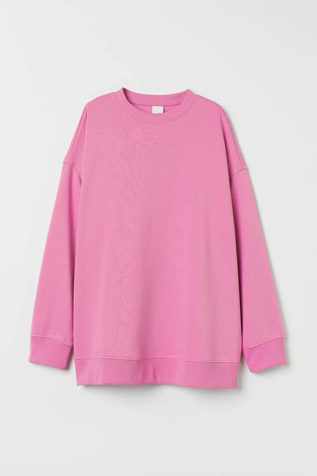 Knallrosa sweatshirt i oversizad modell från H&amp;M.