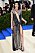 Kendall Jenner i transparent, avslöjande klänning i svart och strass. Med hög slits och högs, spetsiga pumps från Loubutin.