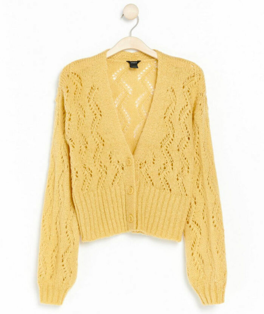 Gul hålstickad cardigan från Lindex.