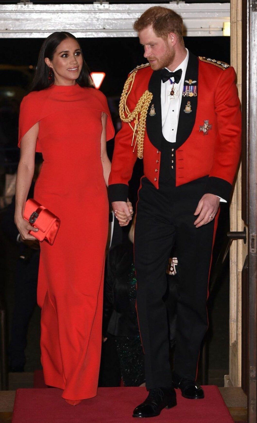 Meghan och Harry matchade i rött på Mountbatten Festival of Music i London tidigare i år. Meghan och Harry i matchande rött