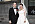 Dominika Peczynski och Anders Borg gifte sig i Stockholm 2018. Dominika bär en vit brudklänning på bilden och en slöja i tyll.