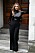 Kate Moss matchar vida byxor med instoppad svart snäv paljettopp.