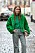 Annabel Rosendahl iklädd grön jacka och matchande grön tröja.