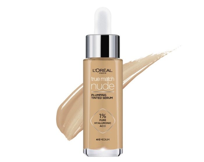 Smear of foundation. Beautiful advertising glance photo. Cosmetics concept isolated on white True Match Nude Plumping Tinted Serum, foundation från L'Oréal Paris