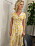 Ulrika Nilsson i gul blommig klänning i TV4 Nyhetsmorgon